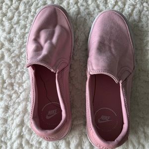 Pink Nike slip on canvas sneakers